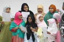 PHOTO ABOVE From left: Salima, Sadia, Salisha, Saffiya, Farah, Sabeha, Sana, Saffiya & Zaria singing a song led by Sis. Sibgha.